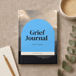 Grief Journal for Teens on a textured surface with a cup of coffee and pen.