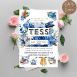 Tea party invitation with floral design and text on a gray background with flowers.