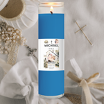 Candle with a blue label featuring a name and photo on a decorative background.